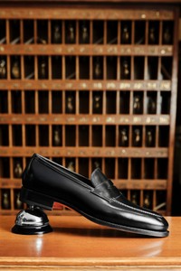 Men's black leather penny loafer - Santoni - editorial
