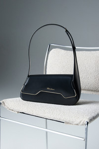 Black leather ThePluto bag - Santoni - editorial