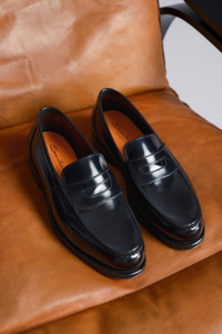 Men's black leather penny loafer - Santoni - editorial
